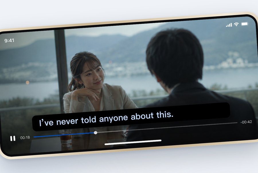 A single slim subtitle line across a landscape video, barely in the way.